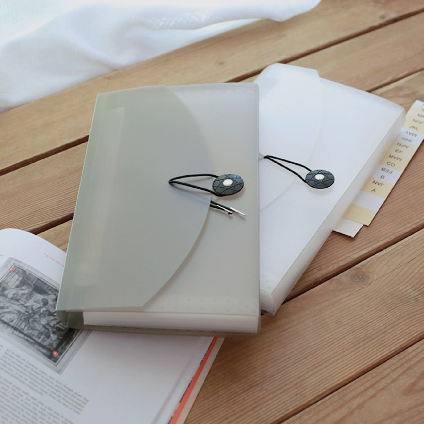 Compact storage albums and folders for journaling materials.